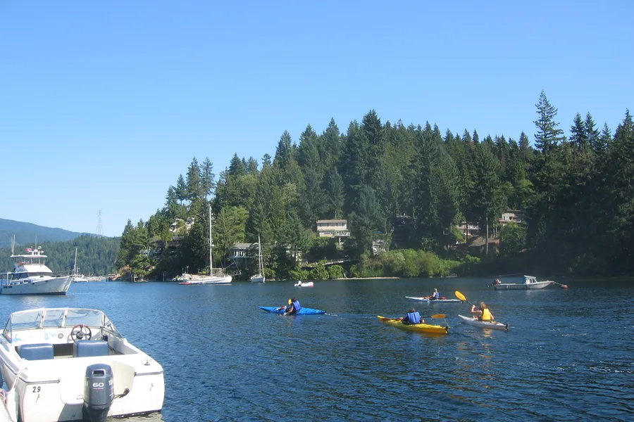 Deep Cove waterfront in North Vancouver with boats and mountains