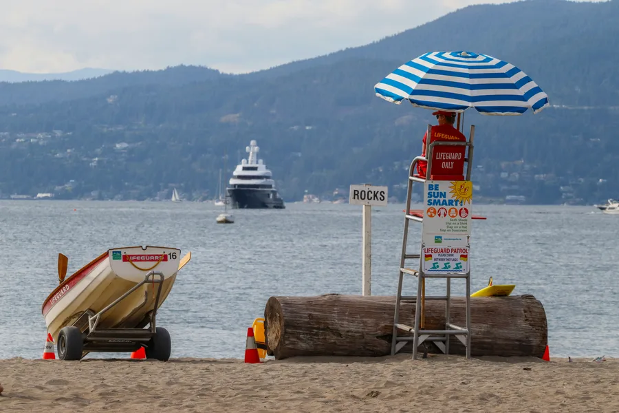 Lifeguard watching the ocean from a beach stand