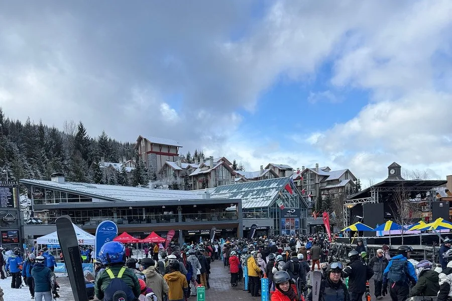 Skiers and snowboarders waiting near the Whistler Village gondola